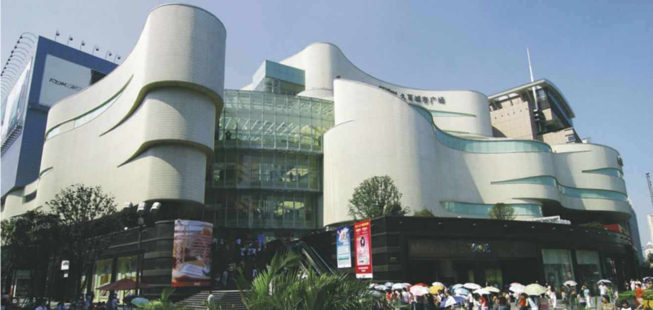 A pedestrian walks past an Ochirly store in Shanghai, China, 13